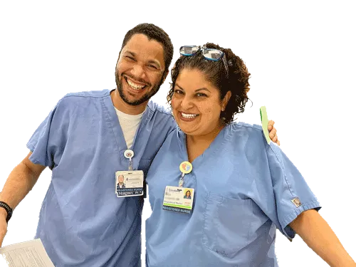 Two PASNAP nurses in blue scrubs and hospital ID badges, smiling
